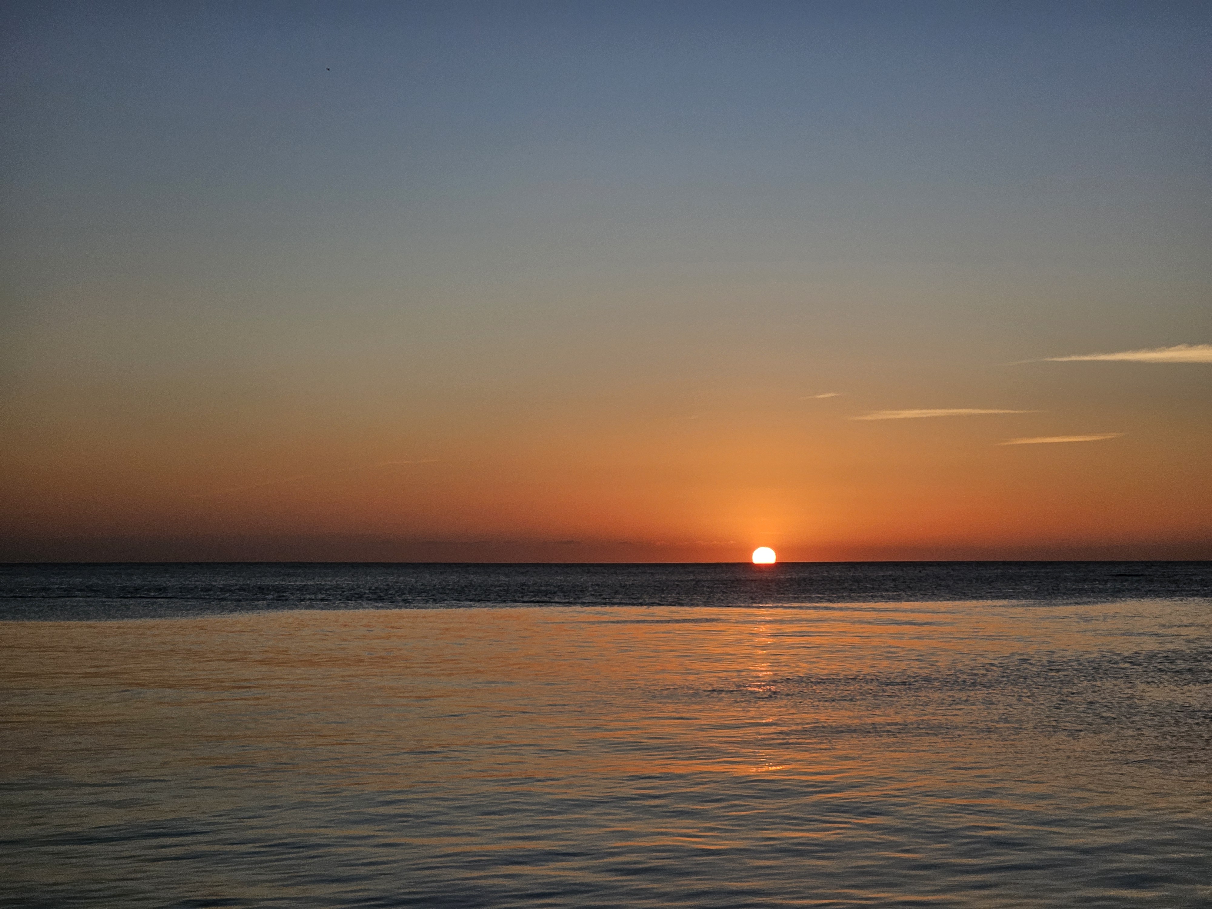 Sunset view along the waterfront in West End Roatan